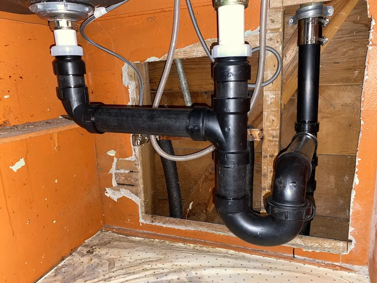 Professional Garbage Disposal Repair equipment and tools on the job in Newark
